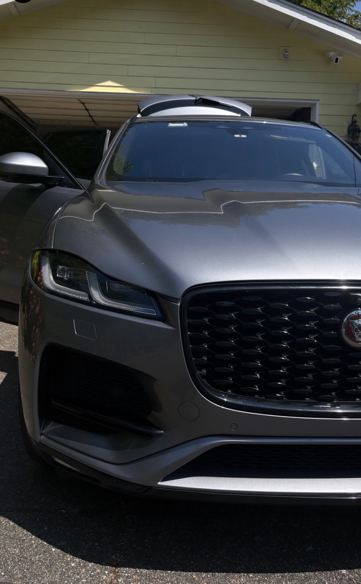 Glossy detailed car paintwork with water beads